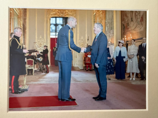 Paul Raymond receiving an MBE from HRH Prince William at Windsor Castle